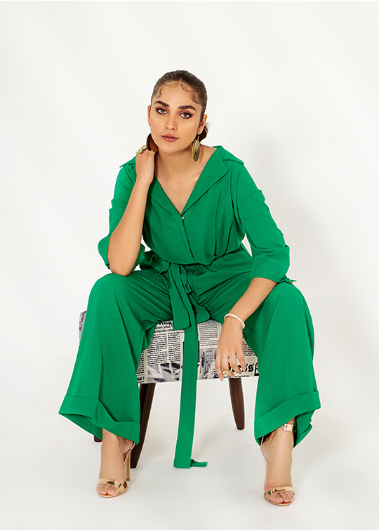 Model wearing a glow green jumpsuit - img 4
