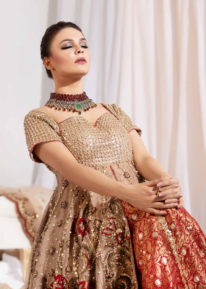 Model wearing Gold Embellished Tail Frock with Red Lehenga -4