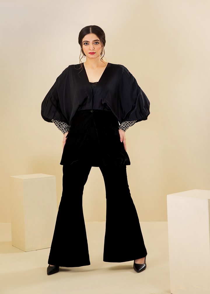 Model wearing black velvet flared sleeve coord set -1