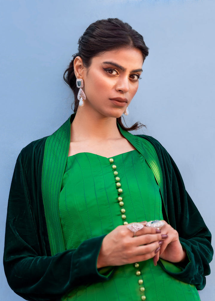 Model wearing green velevt jacket - image 2