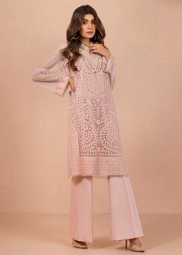model wearing powder embroidered suit with silk trousers -1