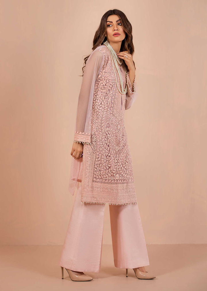 model wearing powder embroidered suit with silk trousers -3