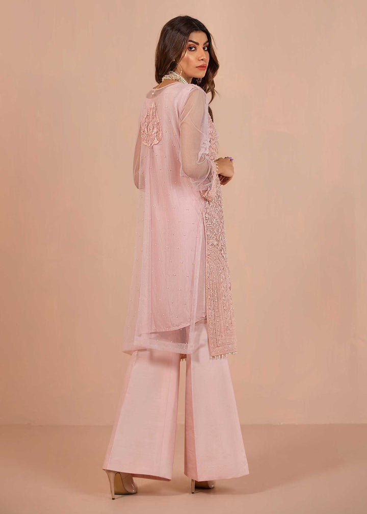 model wearing powder embroidered suit with silk trousers -4