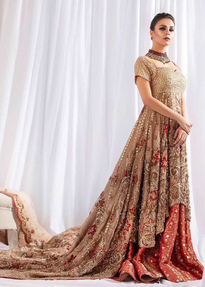 Model wearing Gold Embellished Tail Frock with Red Lehenga -1