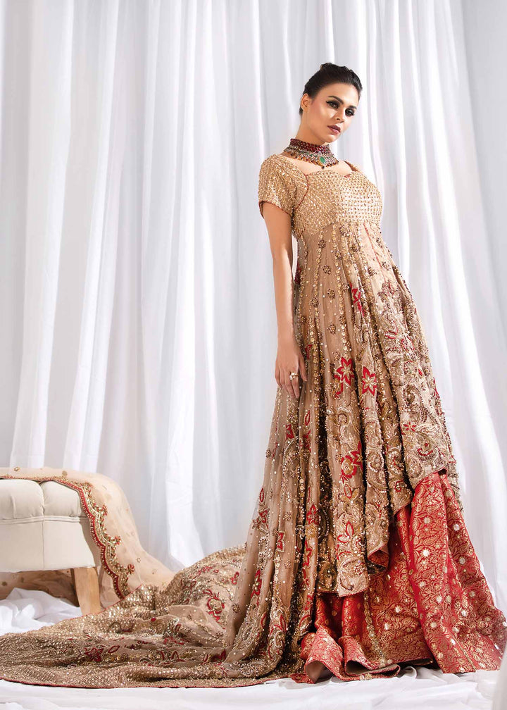 Model wearing Gold Embellished Tail Frock with Red Lehenga -2